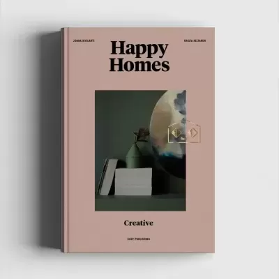 Livro Happy Homes com capa rosa claro e foto de decoração