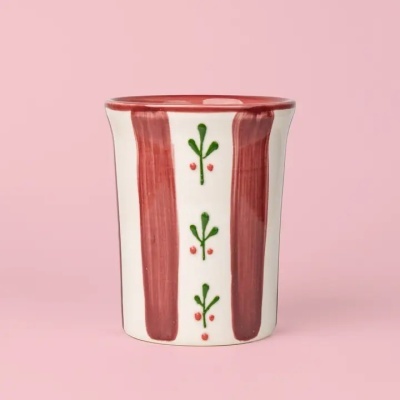 Vaso cilíndrico em cerâmica com decoração vermelha e verde em fundo rosa
