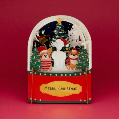 Cartão de Natal com cães e árvores decoradas e o texto MERRY CHRISTMAS