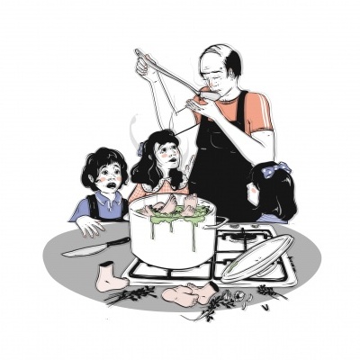 Homem a manipular marionetas de três crianças à volta de mesa redonda com peças e ferramentas