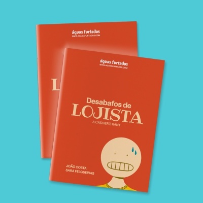 Brochuras laranja com título 'Desabafos de LOJISTA' e ilustração de rosto nervoso.