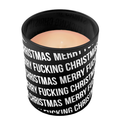 Vela em copo de vidro preto com texto branco Merry Fucking Christmas