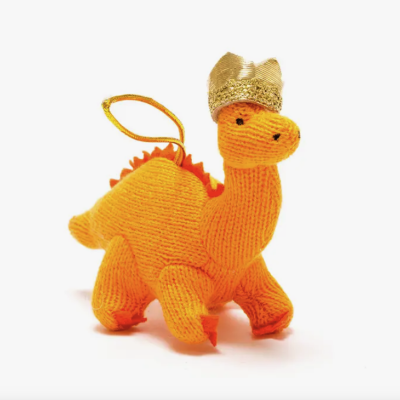 Pelúcia de dinossauro laranja com coroa dourada