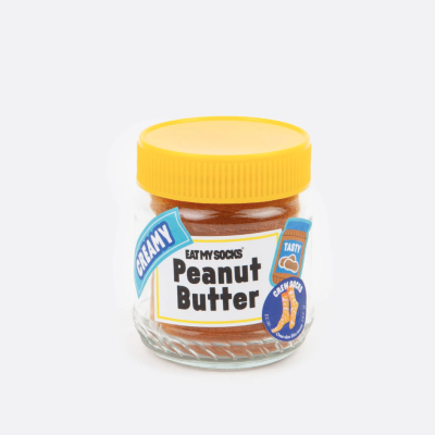 Frasco de pasta de amendoim com tampa amarela e rótulos azuis