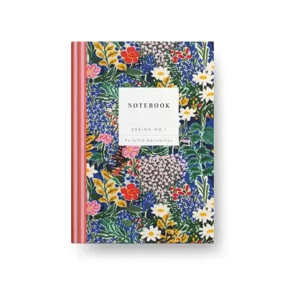 Caderno com capa floral colorida e etiqueta central branca