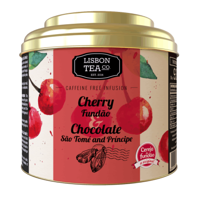 Lata de chá com design vermelho e dourado, ilustrada com cerejas e cacau