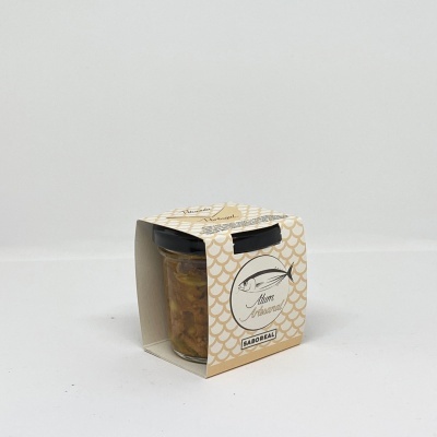 Frasco de amêijoas artesanal em caixa creme com padrão