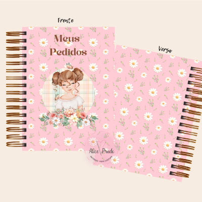 Caderno rosa com flores e desenho de menina na capa, texto Meus Pedidos