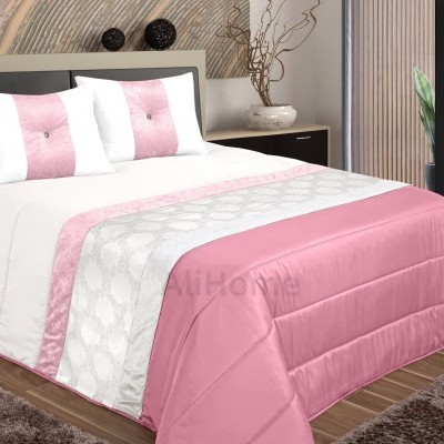 Conjunto roupa de cama rosa e branco com padrão circular em quarto moderno
