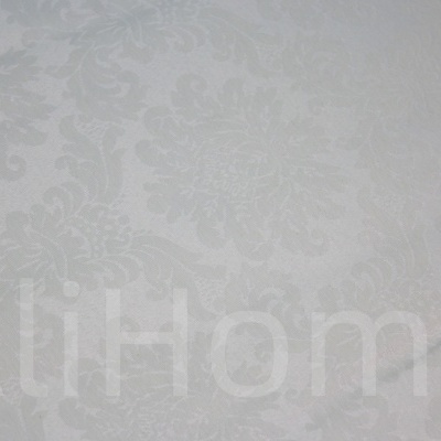 tecido branco com padrão floral em relevo e texto AliHome