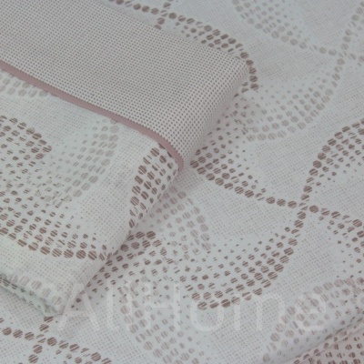 tecido branco com padrão ondulado de pontos castanhos claros