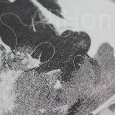 Tecido cinza e preto com padrão abstrato e linhas brancas em close-up