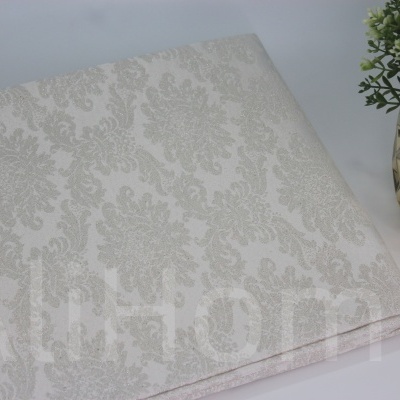 Tecido texturizado com padrão floral em tons bege claro