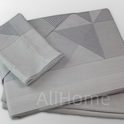 Conjunto de roupa de cama cinza e branco com padrão geométrico riscado