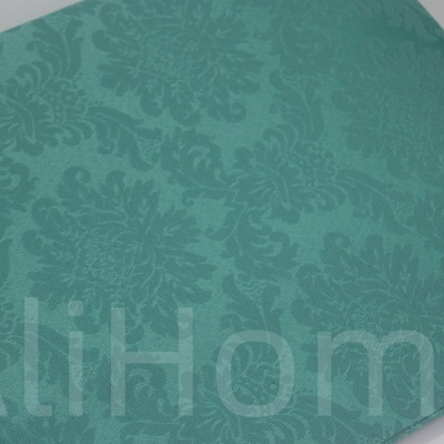 tecido verde água com padrão floral em relevo