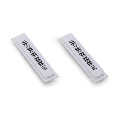 Duas etiquetas brancas com código de barras e texto DRK