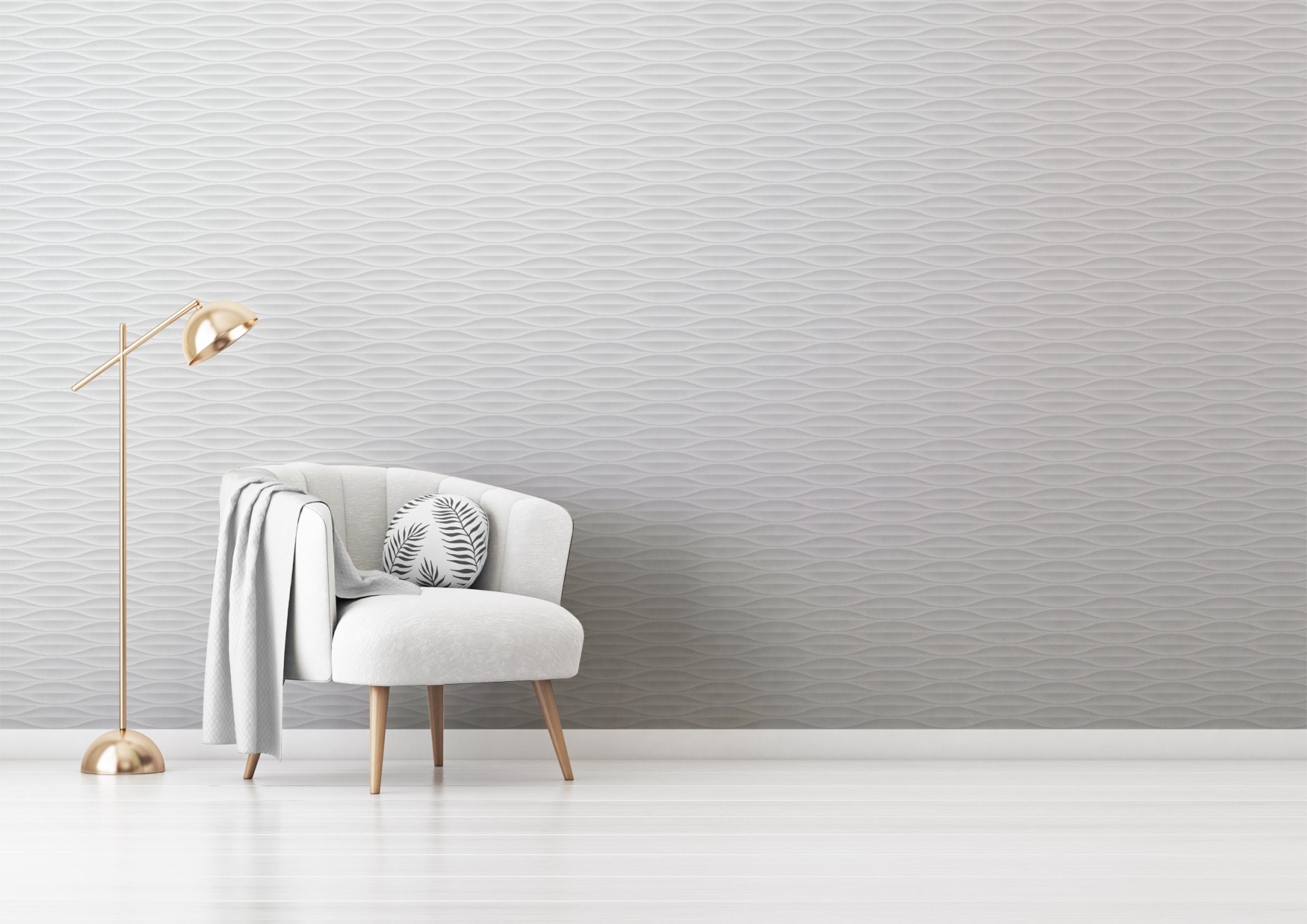 015 cadeira cinzenta com manta e almofada, junto de candeeiro de pé dourado, em ambiente claro com parede ondulada cinzenta