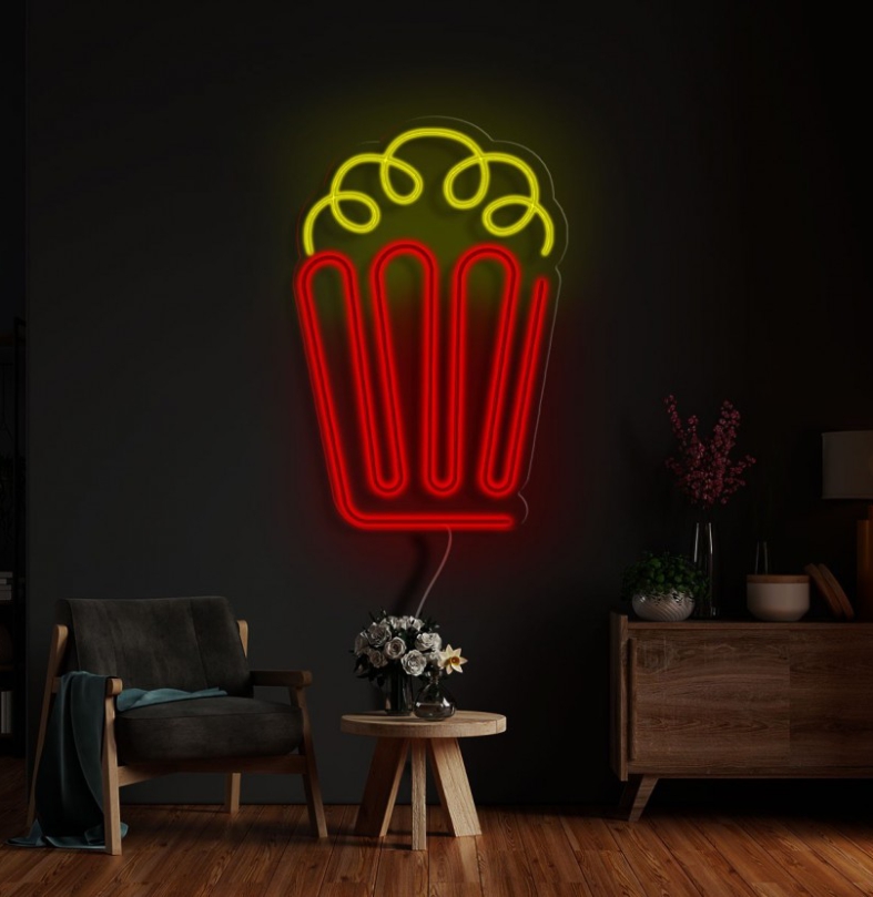 NeonLED | Pipocas Luz de néon em forma de pipoca numa parede escura com mobiliário moderno