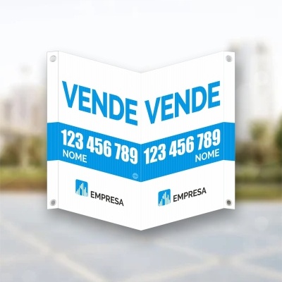 Placa publicitária branca com texto azul 'VENDE VENDE' e contactos