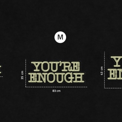 Três tecidos pretos com texto amarelo 'YOU'RE ENOUGH' em três tamanhos diferentes, S, M, L, sobre fundo preto.