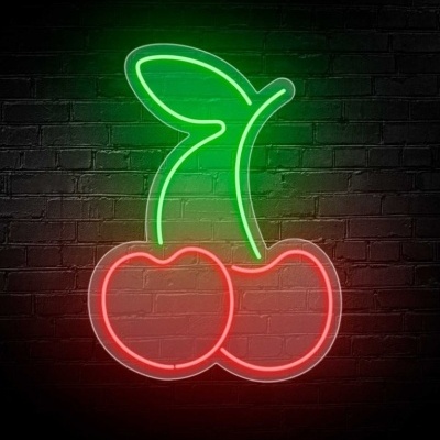 Letreiro néon de cerejas vermelhas com caule e folha verde numa parede de tijolos