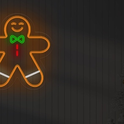Decoração de homem de gengibre em luz de néon junto a árvore de Natal