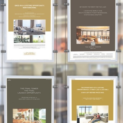 Anúncios imobiliários modernos com imagens de interiores e texto promocional em moldura metálica.