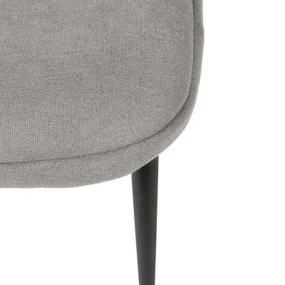 Detalhe de cadeira cinza com perna preta cónica