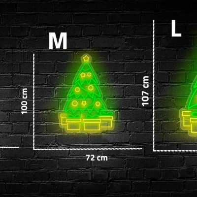 Três árvores de Natal de neon verde em três tamanhos diferentes sobre fundo de tijolos pretos