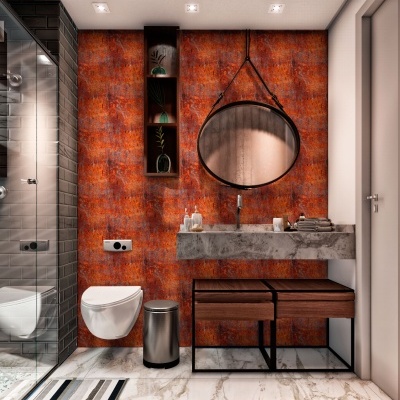 Casa de banho moderna com parede laranja, sanita suspensa, lava-mãos de betão e espelho redondo