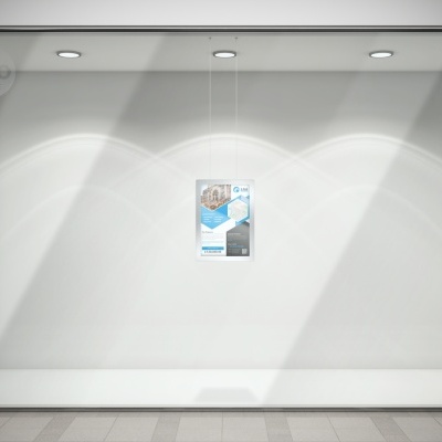 Montra de loja vazia com iluminação e cartaz pendurado