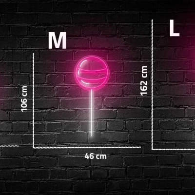 Luminárias de LED rosa em forma de bastão em três tamanhos diferentes contra parede de tijolo preto