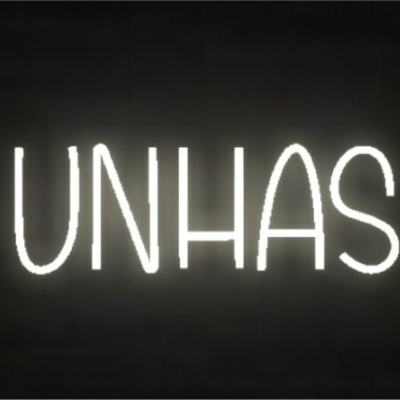 Letreiro néon branco com a palavra UNHAS em fundo escuro