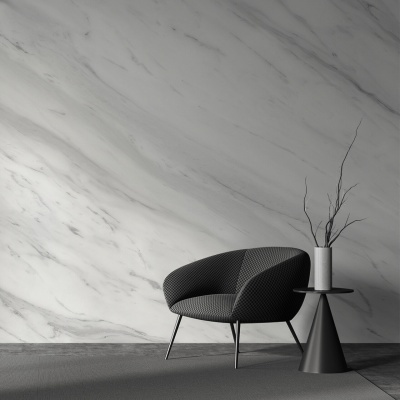 Cadeira cinzenta moderna com mesa lateral negra e vaso com ramos secos