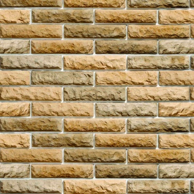 Revestimento de parede em tijolos decorativos bege e castanho claro com textura rugosa