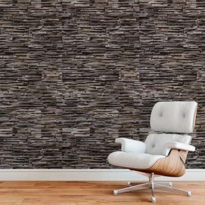 Cadeira branca moderna frente a parede de pedra cinzenta e castanha