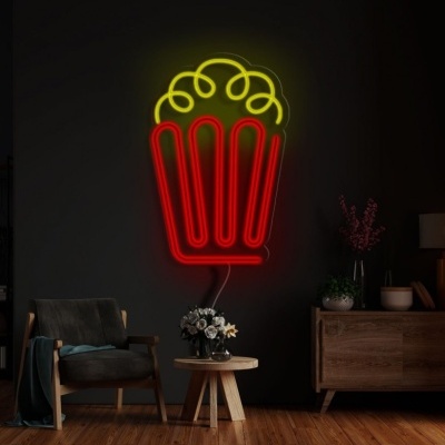 Luz de néon em forma de pipoca numa parede escura com mobiliário moderno