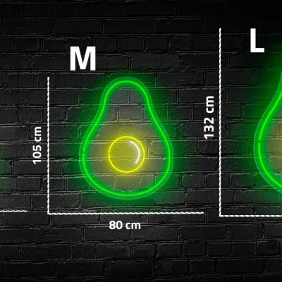 Três abacates de neon verde em tamanhos S, M e L em fundo de tijolos pretos