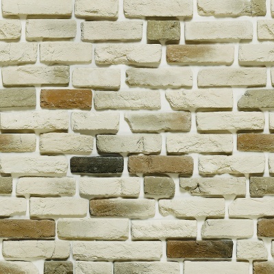 Parede de tijolos decorativos brancos com tijolos marrons, bege e pretos