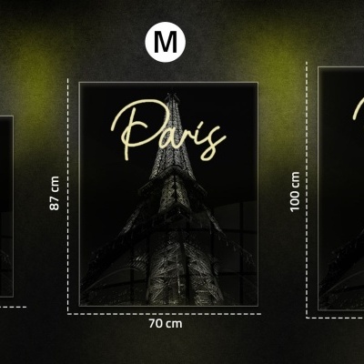 Três quadros decorativos com torre Eiffel em preto e cinzento com a palavra 'Paris' em dourado em três tamanhos