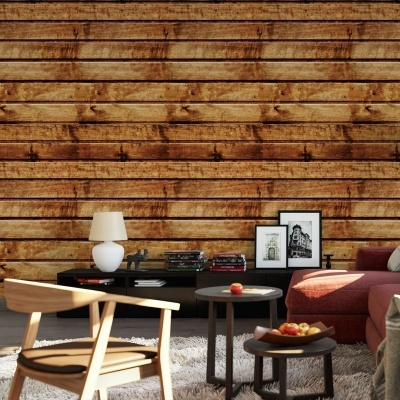 sala de estar com parede de madeira rústica, móveis de madeira clara, sofá rosa, mesas redondas escuras, tapete branco e objetos decorativos