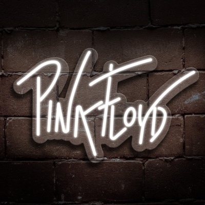 Sinal de néon branco com a palavra PINK FLOYD numa parede de tijolos