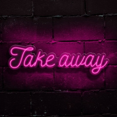 Neon rosa com texto Take away em muro de tijolos escuros
