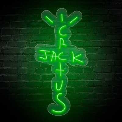 Luminária de neon verde em forma da palavra CACTUS com palavra JACK horizontal, em parede de tijolos pretos