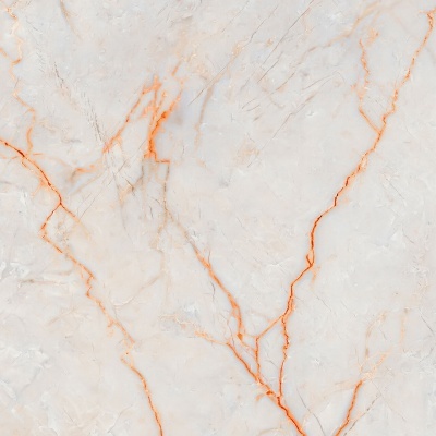 Superfície de mármore clara com veios laranja