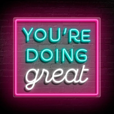 Letreiro luminoso de néon com texto motivacional em fundo escuro