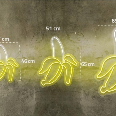 Sinais de néon amarelos em forma de bananas de vários tamanhos com dimensões em centímetros