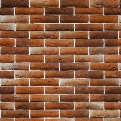 Parede de tijolos castanho avermelhados com juntas de argamassa branca