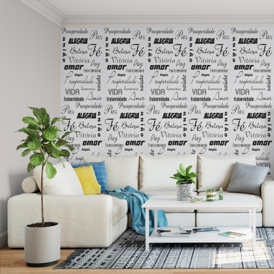 Sala de estar com sofá branco, almofadas coloridas, mesa de centro branca, plantas e papel de parede com palavras em português