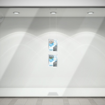 Montra de loja minimalista com dois cartazes suspensos e iluminação embutida